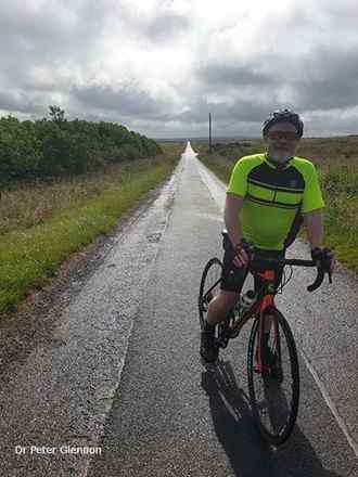 Dr Peter Glennon cycling in Scotland